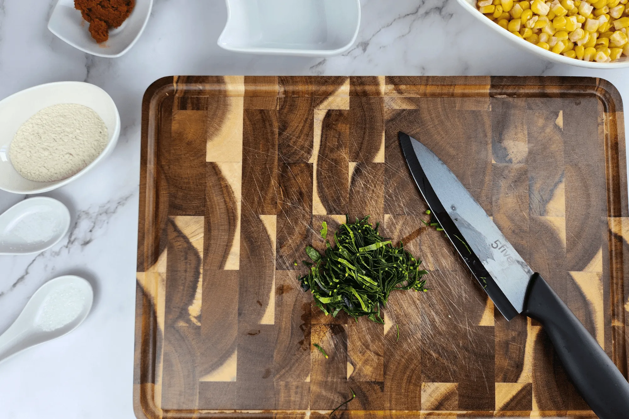 Slice the kaffir lime leaves into thin strips.