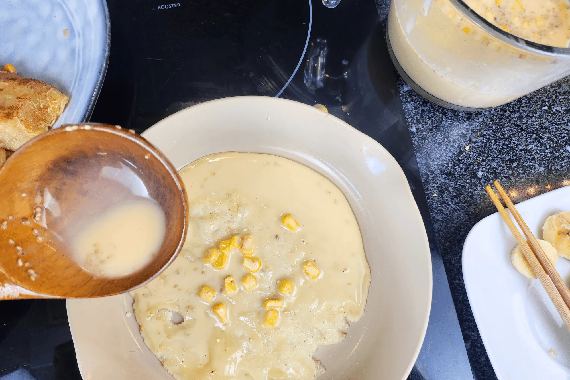 Spreading batter in a pan with coconut oil