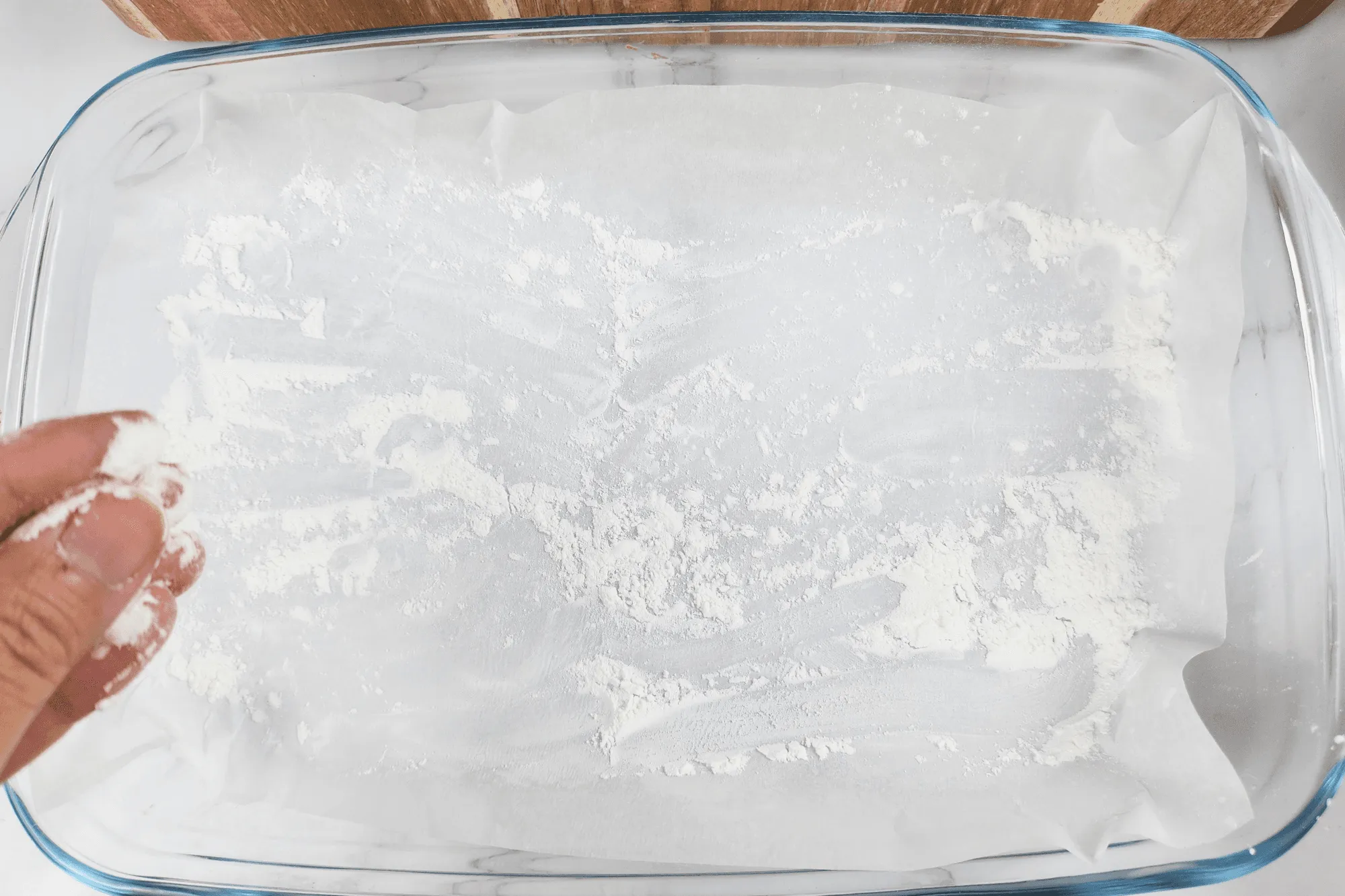 Sprinkle some flour onto the surface or container