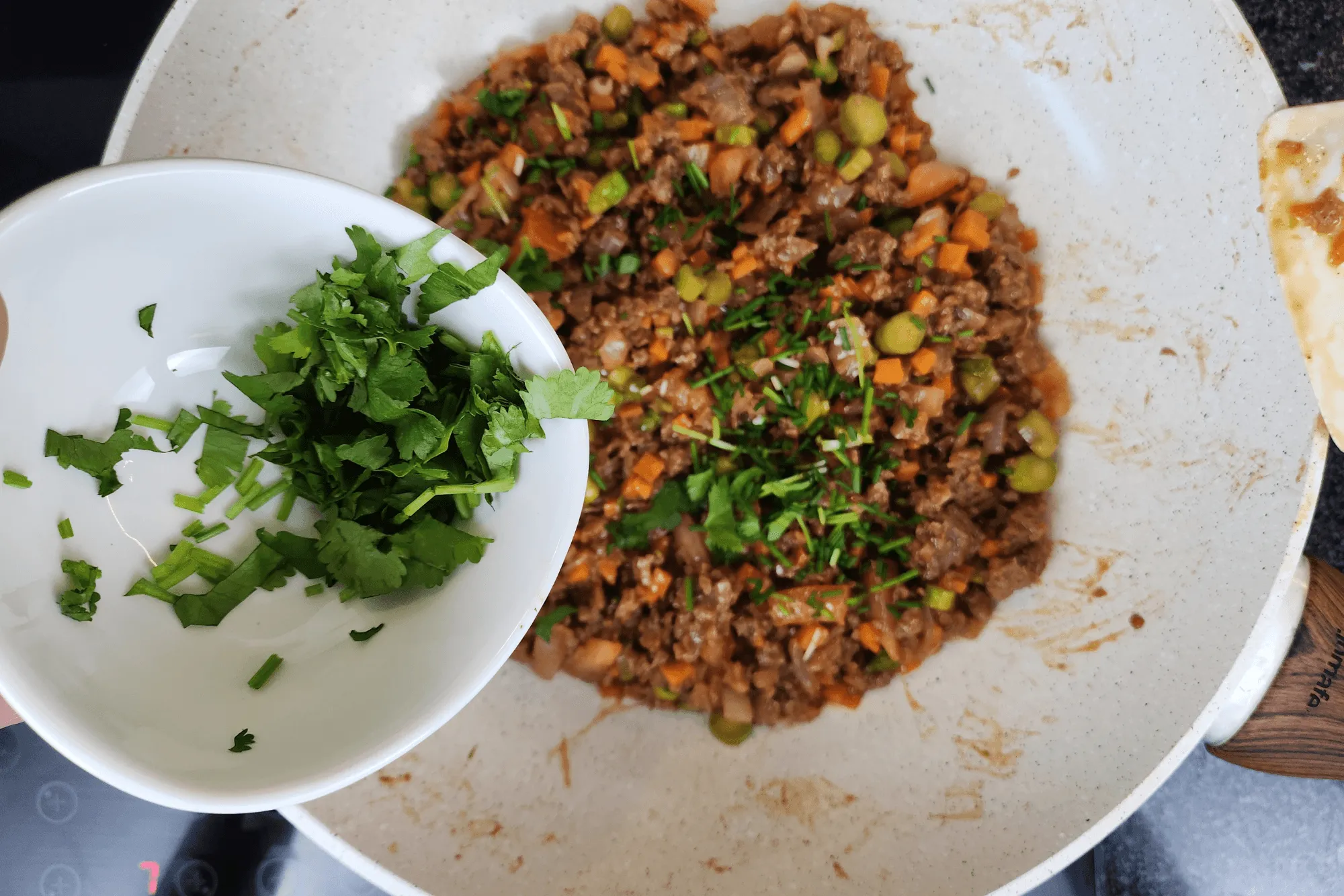 Stir in the scallion and coriander, mix thoroughly, then remove from heat and set aside.