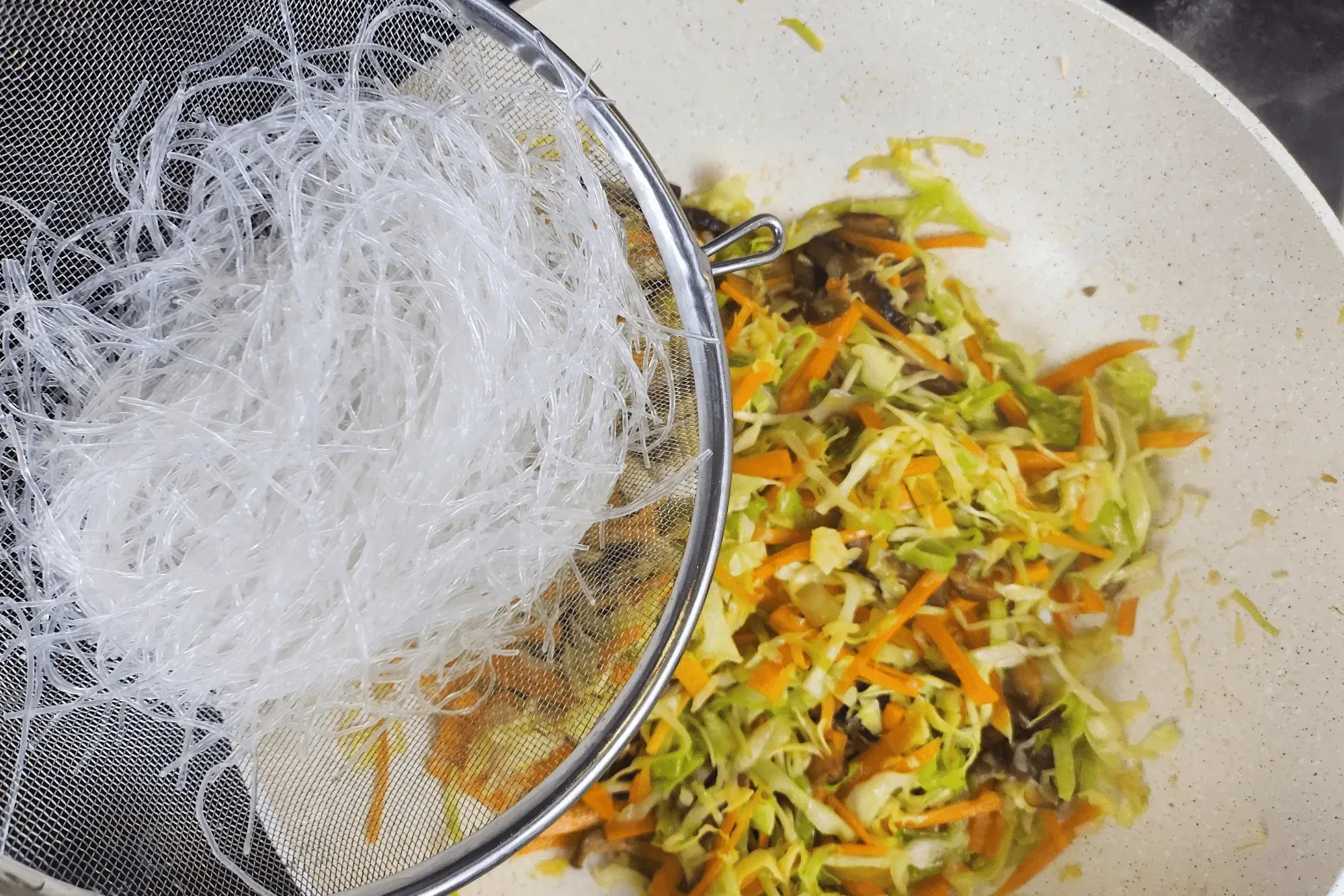 Toss in the glass noodles and stir-fry for another 1-2 minutes until well combined.