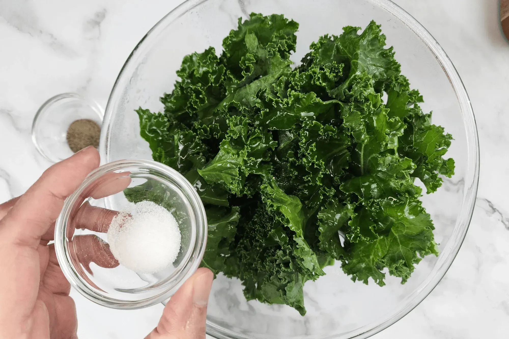 Toss the kale with olive oil, salt