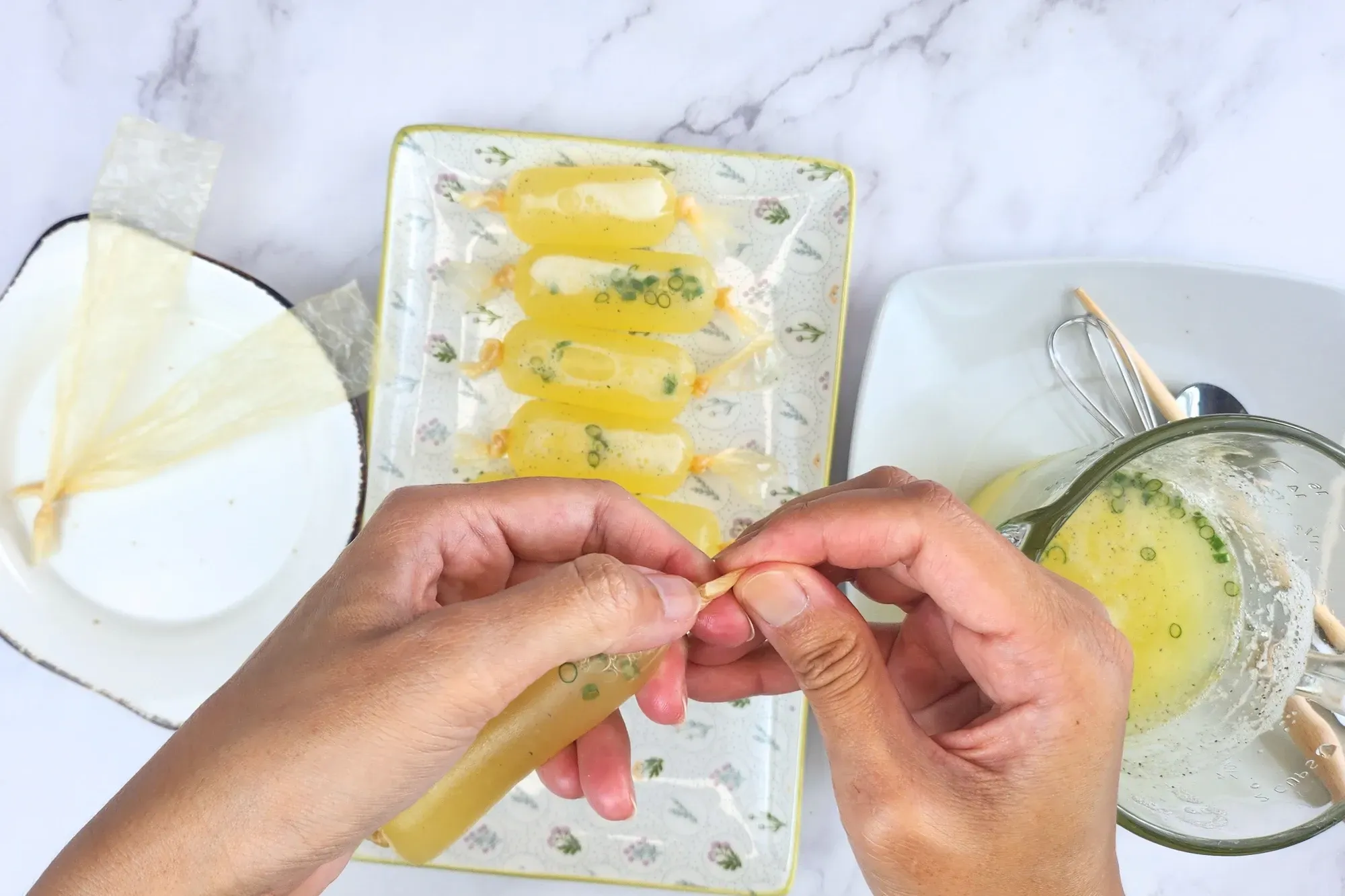 Two hand tie up a sausage