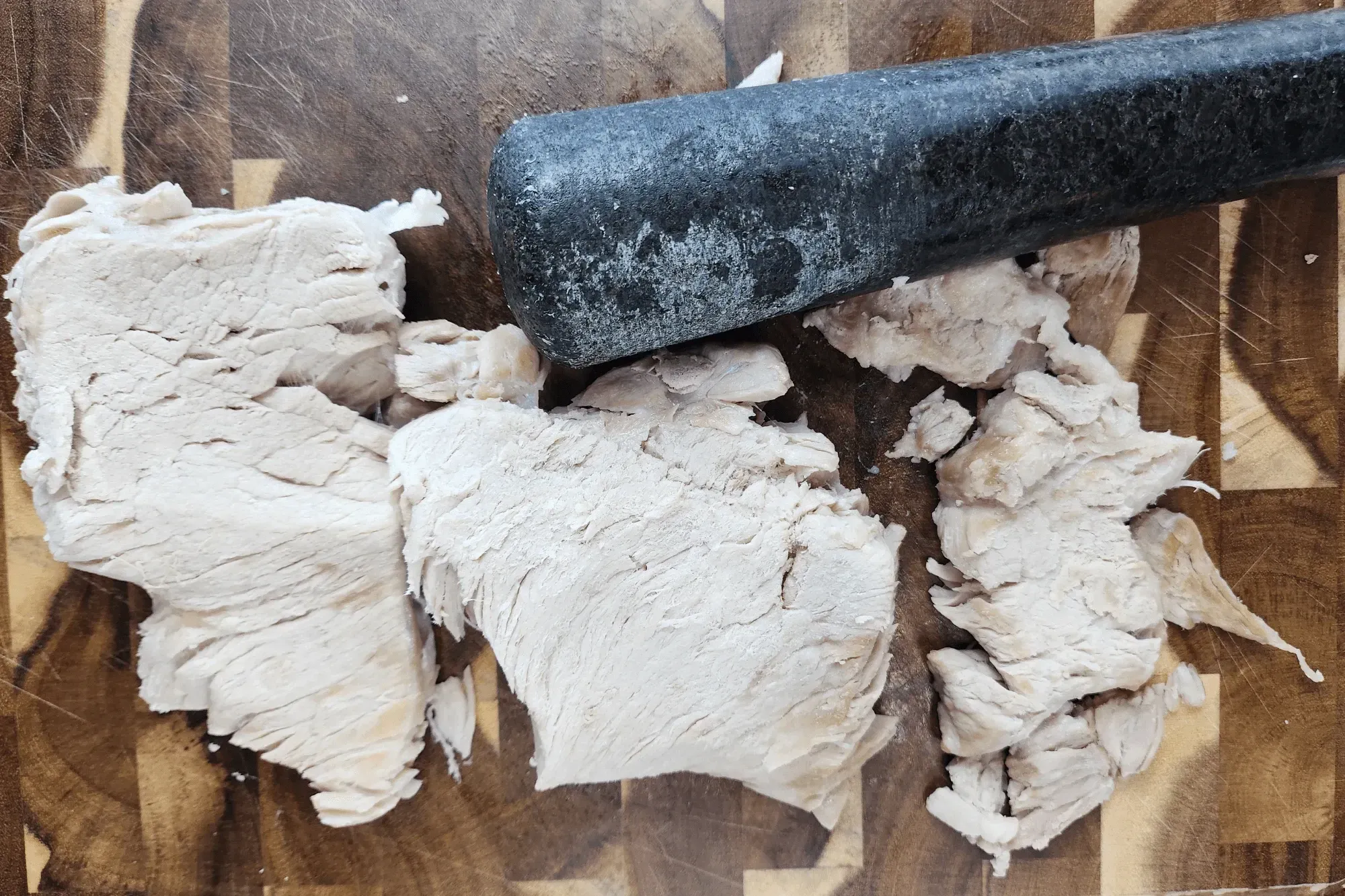  use a meat mallet or a pestle before shredding it into thin strips
