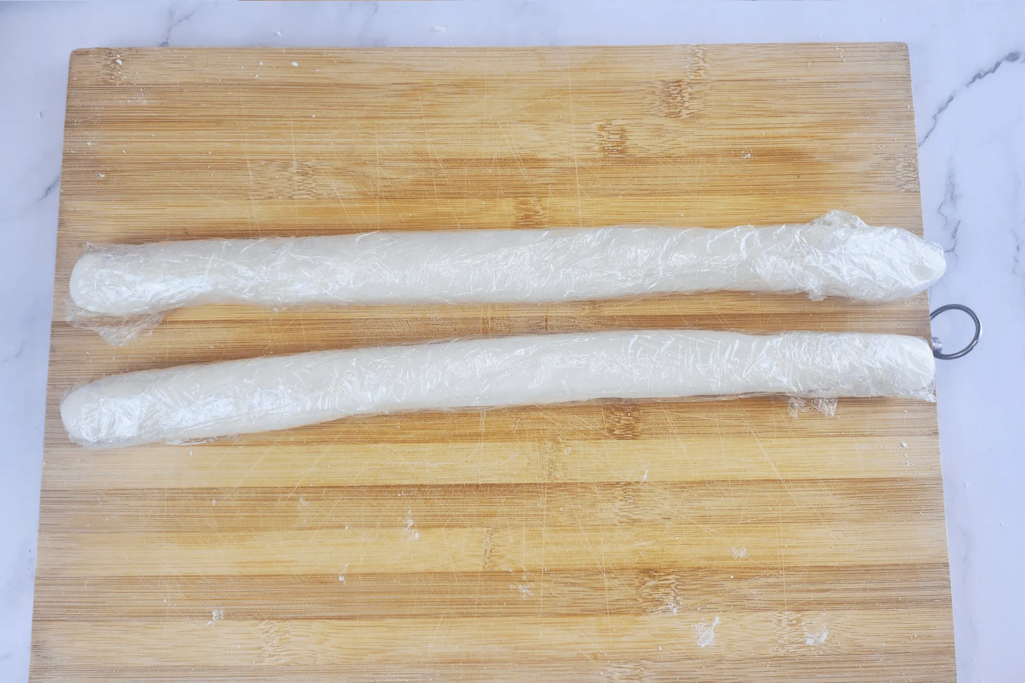 Wrap each log in plastic wrap and let it rest for 30 minutes. 